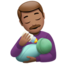 Man Feeding Baby: Medium Skin Tone emoji on Apple