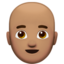 Man: Medium Skin Tone, Bald emoji on Apple