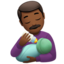 Mann, der Baby die Flasche gibt: mitteldunkle Hautfarbe-Emoji auf Apple