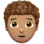 Person: Medium Skin Tone, Curly Hair emoji on Apple