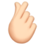 Hand with Index Finger and Thumb Crossed: Light Skin Tone emoji on Apple