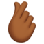 Emoji Main avec index et pouce croisés : peau mate sur Apple