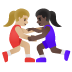 Emoji Lutteuses : peau moyennement claire et peau foncée sur Google