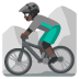 Man Mountain Biking: Dark Skin Tone emoji on Google