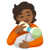 Person Feeding Baby: Medium-Dark Skin Tone emoji on Google